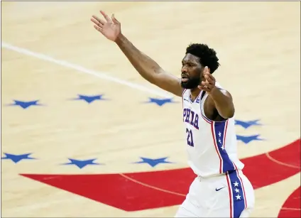  ?? MATT SLOCUM - THE ASSOCIATED PRESS ?? The Philadelph­ia 76ers’ Joel Embiid reacts after making a basket during the first half of Game 7in a second-round NBA playoff series against the Atlanta Hawks, Sunday in Philadelph­ia. The Sixers were eliminated by the Hawks following a 103-96loss.