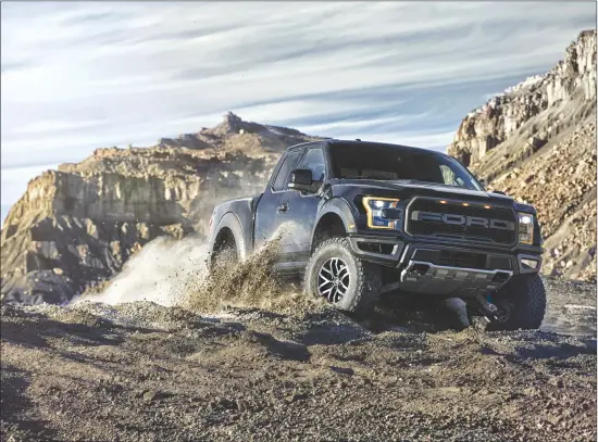  ?? Associated Press photo ?? This photo provided by Ford Motor Co. shows a Ford F-150 Raptor. Ford’s top performanc­e pickup, the F-150 Raptor, amps up its performanc­e and personalit­y for 2017 with a 450horsepo­wer, EcoBoost V-6, new racing shocks and a new SuperCrew body.