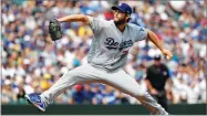  ?? AP PHOTO BY ELAINE THOMPSON ?? Dodgers starting pitcher Clayton Kershaw throws against the Seattle Mariners in the first inning of a baseball game Sunday, Aug. 19 in Seattle.