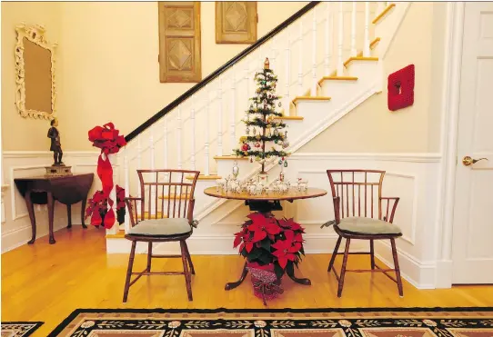  ?? TONY CALDWELL ?? Joan Burney takes a minimalist approach to decorating her Rockcliffe home at Christmast­ime, so as not to detract from her collection of antique furniture.