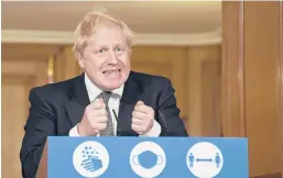  ?? ALBERTO PEZZALI/AP ?? British Prime Minister Boris Johnson, who was hospitaliz­ed in the spring after contractin­g the virus, is taking much of the blame for the U.K’s response to the crisis.