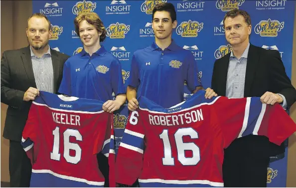  ?? LARRY WONG ?? Oil Kings head coach Steve Hamilton, left, and general manager Randy Hansch, right, welcome the team’s two first-round draft picks Liam Keeler and Matthew Robertson in Edmonton on Monday.