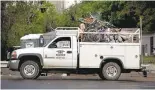  ??  ?? Bikes collected from a sweep at a homeless camp on San Carlos Street are piled in a contractor’s truck in San Jose.