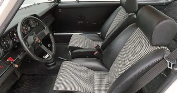  ??  ?? Below: With correct houndstoot­h material from Eric Linden, the factory sports seats in Dave’s 911 were retrimmed by Tony Garcia at Autobahn Interiors
