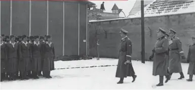  ?? BRANDENBUR­G MEMORIAL FOUNDATION ?? Heinrich Himmler, head of the SS, inspects the female guards at Ravensbrüc­k. The camp opened in May 1939, just months before the outbreak of war, and was liberated by the Russians six years later.