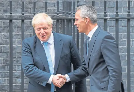  ?? Picture: PA. ?? Boris Johnson, left, welcomes the Secretary General of Nato, Jens Stoltenber­g, to 10 Downing Street.