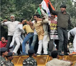  ?? — PTI ?? Delhi Pradesh Congress Committee activists shout slogans during a protest against the BJP and non-declaratio­n of Gujarat elections outside the Election Commission in New Delhi on Monday.