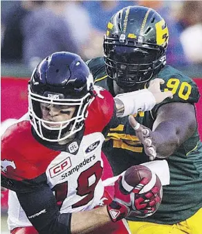  ?? THE CANADIAN PRESS FILES ?? Eskimos defensive lineman Almondo Sewell, shown here sacking Calgary QB Bo-Levi Mitchell last season, says he’s embracing the pressure of being the host city for the 106th Grey Cup.