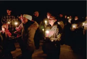  ?? KELCEY WRIGHT-JOHNSON/ORANGEVILL­E BANNER ?? More than 100 people gathered in Waldemar, Ont., on Thursday night to remember 3-year-old Kaden Young.