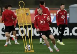  ?? ?? CENTURY DUTY: Bale trains yesterday for his landmark night