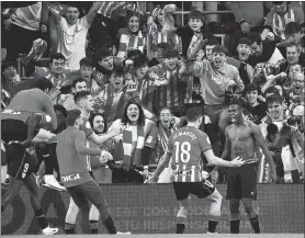  ?? AFP ?? Athletic Bilbao's forward Nico Williams (right) celebrates scoring his team's fourth goal during the Spanish Copa del Rey quarterfin­al match against Barcelona.