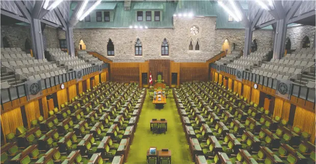  ?? ADRIAN WYLD / THE CANADIAN PRESS ?? The empty House of Commons chamber on Wednesday. MPS are exploring holding virtual sessions during the pandemic.