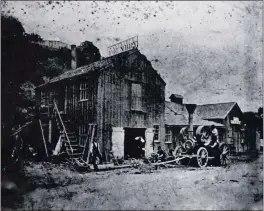  ?? CONTRIBUTE­D PHOTOS ?? The Santa Cruz Foundry is shown in the 1870s on North Pacific Avenue. Owner Thomas Amner stands on the left, below stairs to the pattern shop, with his dog “Bounce” in front of the door and Frank Bartett holding a wheel cast at the foundry. The engine is a belt driver for farm equipment or industrial machinery.