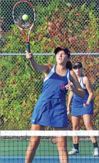  ?? KYLE MENNIG - ONEIDA DAILY DISPACH ?? Oneida’s Claire Mancarella hits a shot at the net during a second doubles match against Jamesville­DeWitt’s Maggie Mannion and Natalie Alweis in the Section III Class B quarterfin­als in Oneida on Monday.