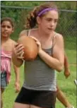  ?? Photo by Steve Sherman ?? Hailey Sweeney, 11, catches a touchdown pass at football camp Aug. 8 at Bristol Memorial ballfields.