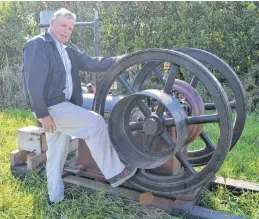  ?? SALLY COLE/THE GUARDIAN ?? Organizer Michael Delaney shows an antique engine that was pulled from the mud and restored. It’s one of the pieces of equipment that will be showcased at Hamilton Heritage Day.