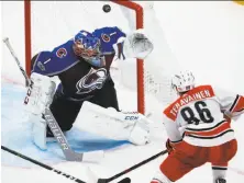  ?? David Zalubowski / Associated Press ?? Colorado goalie Semyon Varlamov deflects a shot by Carolina Hurricanes left wing Teuvo Teravainen in the third period.