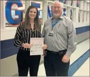  ?? Contribute­d ?? Bill Abline (right), manager of Fort Oglethorpe Food City, presents a check for $556 to Melissa Butler, principal of Heritage Middle School.