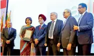  ??  ?? Shea Wickramasi­ngha, Group Managing Director – CBL Group with the award amongst other dignitarie­s.
