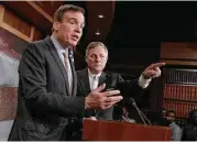  ?? J. Scott Applewhite / Associated Press ?? Sen. Mark Warner, D-Va., left, with Sen. Richard Burr, R-N.C., said 1,000 internet trolls in Russia could have generated fake news during the U.S. election.