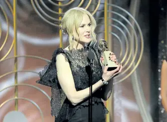  ?? PAUL DRINKWATER/THE ASSOCIATED PRESS ?? Nicole Kidman accepting the award for best performanc­e by an actress in a limited series or motion picture made for TV for her role in Big Little Lies, at the 75th Annual Golden Globe Awards in Beverly Hills, Calif., on Sunday.