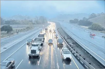  ?? SHERRY LAVARS — MARIN INDEPENDEN­T JOURNAL ?? Commute traffic rolls south in the rain on a stretch of Highway 101in San Rafael on Wednesday. Marin is getting some relief from the current rain, but local officials say much more is needed to handle the drought’s impact.