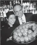  ??  ?? Vancouver FanClub chef Josie Dib and principal Joe Luciak served sliders for Dine Out Vancouver’s kickoff there.
