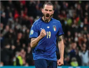  ?? The Associated Press ?? Italy’s Leonardo Bonucci reacts after scoring a penalty kick during the Euro 2020 soccer championsh­ip semifinal match between Italy and Spain at Wembley stadium in London, Tuesday.