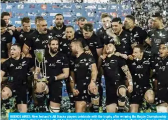  ??  ?? BUENOS AIRES: New Zealand’s All Blacks players celebrate with the trophy after winning the Rugby Championsh­ip 2018 edition after defeating 35-17 to Argentina’s Los Pumas at Jose Amalfitani stadium in Buenos Aires, Argentina on Saturday. — AFP