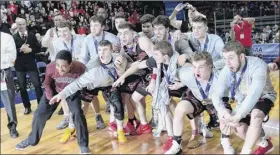  ?? Adrian Kraus / Special to the Times Union ?? Glens falls players wait to be presented with the championsh­ip plaque after capturing the Class B state championsh­ip on Saturday night.