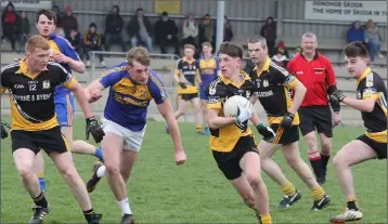  ??  ?? James Byrne looks for a gap for Kilrush in their victory against Gusserane on Sunday.