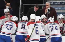  ?? Getty IMaGes FIle ?? POSITIVELY POSITIVE: Canadiens interim coach Dominique Ducharme, back right, tested positive for COVID-19 on Friday and missed Game 3 of Montreal’s semifinal series against Vegas last night.