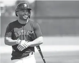  ?? KAREN WARREN/HOUSTON CHRONICLE VIA AP ?? Astros second baseman Jose Altuve smiles before taking batting practice during a spring training workout Tuesday.