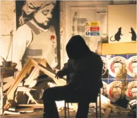  ?? Producers Distributi­on ?? The mysterious Banksy in the documentar­y “Exit Through the Gift Shop.”