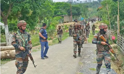  ?? ?? Indian army soldiers on patrol earlier this month amid an outbreak of ethnic violence in the north-eastern state of Manipur. Photograph: Indian Army/Reuters