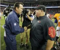  ?? JACK DEMPSEY — THE ASSOCIATED PRESS ?? San Francisco head coach Chip Kelly, right, shakes hands with Denver coach Gary Kubiak after a preseason game last week. Kelly has yet to name a starting QB for the 49ers.