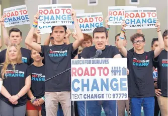  ?? WILFREDO LEE/ASSOCIATED PRESS ?? Cameron Kasky, center, announces Monday multi-state bus tours by Marjory Stoneman Douglas High School students to promote activism and champion gun control.