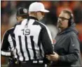  ?? DAVID ZALUBOWSKI — ASSOCIATED PRESS ?? Gregg Williams speaks with umpire Clay Martin during the second half against the Broncos on Dec. 15 in Denver.