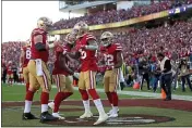  ?? ANDA CHU — BAY AREA NEWS GROUP ?? San Francisco 49ers’ Tevin Coleman (26) celebrates with teammate Michael Person (68) after scoring a touchdown against the Minnesota Vikings in the second quarter of their NFC divisional playoff game at Levi’s Stadium in Santa Clara on Saturday.