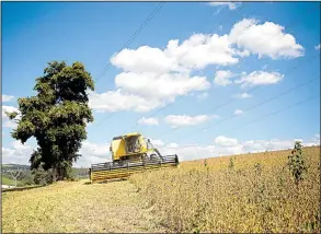  ?? Bloomberg News/PATRICIA MONTEIRO ?? A combine harvests soybeans near Atibaia, Brazil, earlier this year. Analysts expect Brazil to be the world’s top soybean exporter this year, ahead of the U.S.