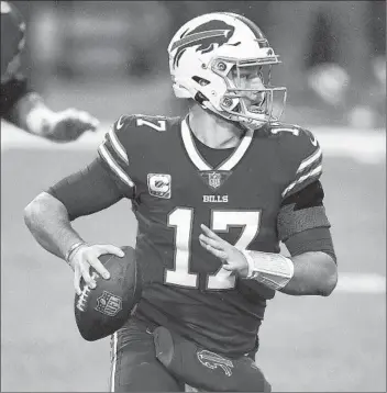  ?? ADRIAN KRAUS/AP ?? Bills quarterbac­k Josh Allen looks to pass against the Chiefs during a game on Oct. 19 in Orchard Park, N.Y.