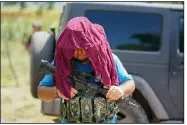  ?? (AP/Eduardo Verdugo) ?? An armed man who claims to be a member of a self-defense group patrols the limits of Taixtan in the Michoacan state of Mexico on Thursday.