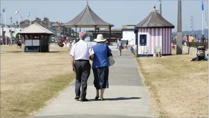  ??  ?? People enjoying a stroll on a tidy Bray seafront, where a ‘phenomenal’ amount of rubbish was collected at the weekend.