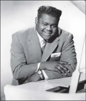  ?? AP PHOTO ?? Fats Domino is shown in 1956. The amiable rock ‘n’ roll pioneer whose steady, pounding piano and easy baritone helped change popular music even as it honoured the grand, good-humored tradition of the Crescent City, has died. He was 89.