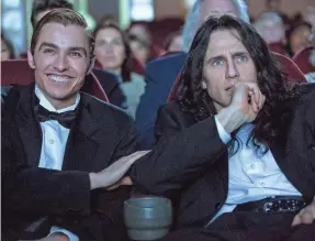  ?? JUSTINA MINTZ/A24 ?? Greg (Dave Franco, left) and Tommy (James Franco) at the failed premiere of “The Room” in “The Disaster Artist.”