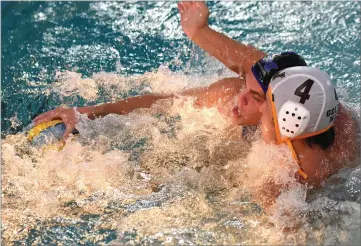  ?? RECORDER PHOTO BY CHIEKO HARA ?? Monache High School's Garrett Keller tries to keep the ball as Golden West High School's Brandon Green presses Tuesday, during the second half at Monache High School.