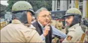  ?? PTI ?? Noted historian Ramachandr­a Guha being detained by police during a protest against CAA in Bengaluru on Thursday.