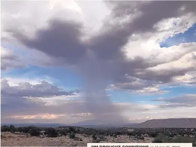  ?? ROBERT BROWMAN/JOURNAL ?? An afternoon shower drops rain near San Ysidro on July 24. The Sandia Mountains are in the distance. Although recent rains have helped, the region is still grappling with long-term drought.