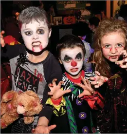  ??  ?? Fionn and Donnacha Quigg with Clodagh Hoare enjoying the Halloween Fancy Dress at the Red Fox on Saturday.