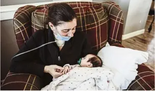  ??  ?? A mother’s love: Kelsey meeting her daughter Lucy for the first time in Poynette, Wisconsin. —AP